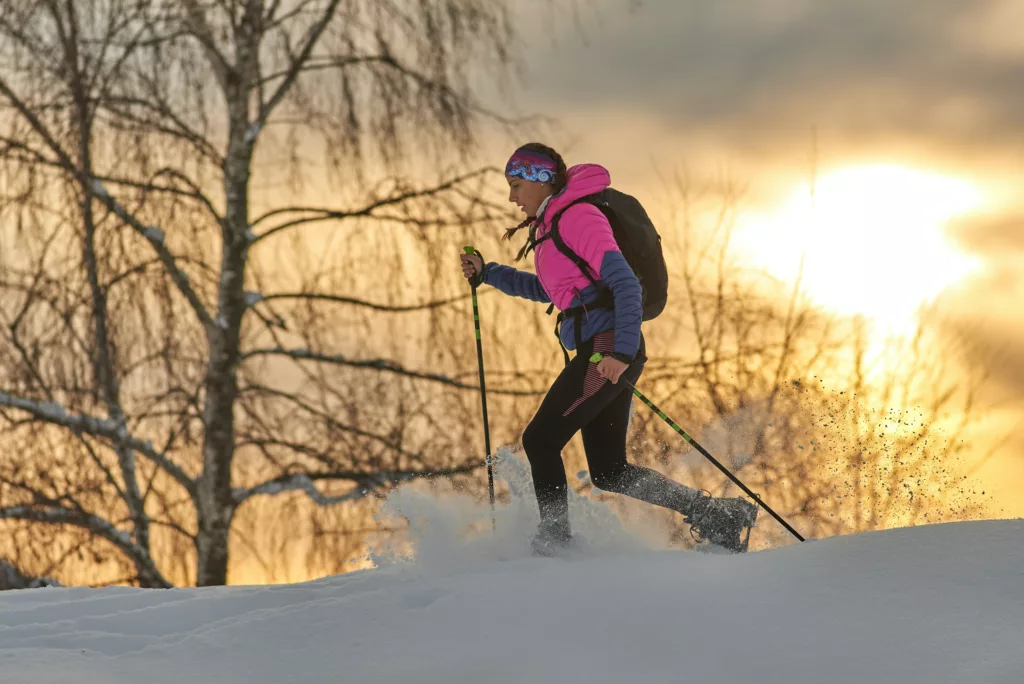 Skiier dressed appropriately for snow and activitiy